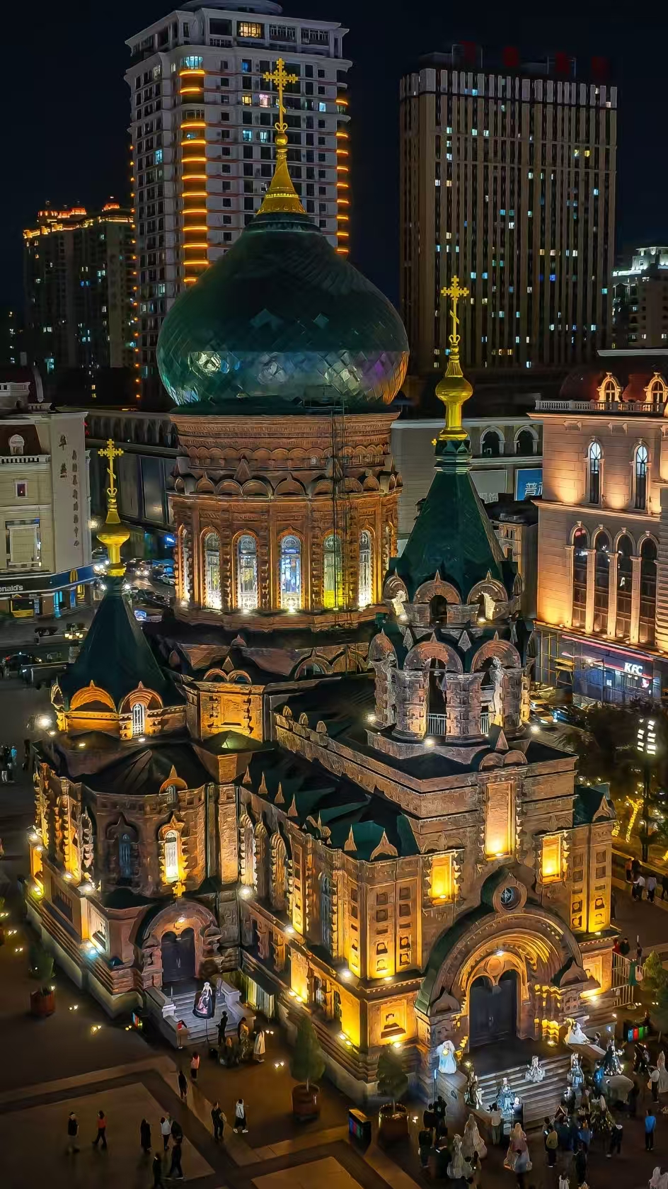 St. Sophia Cathedral in Harbin at night with green onion dome and golden floodlights