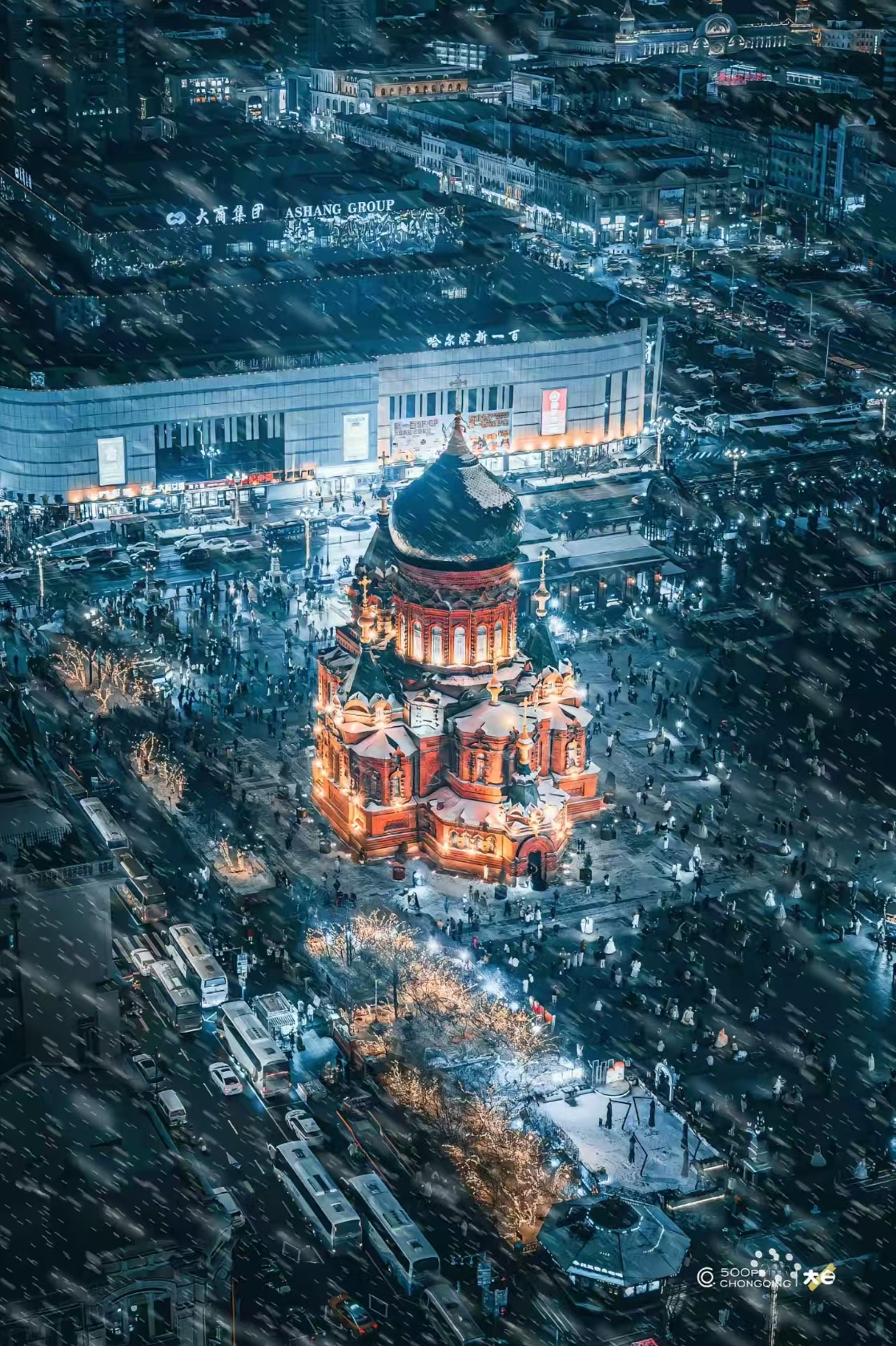 St. Sophia Cathedral aerial view in heavy snow with red brick walls and green dome