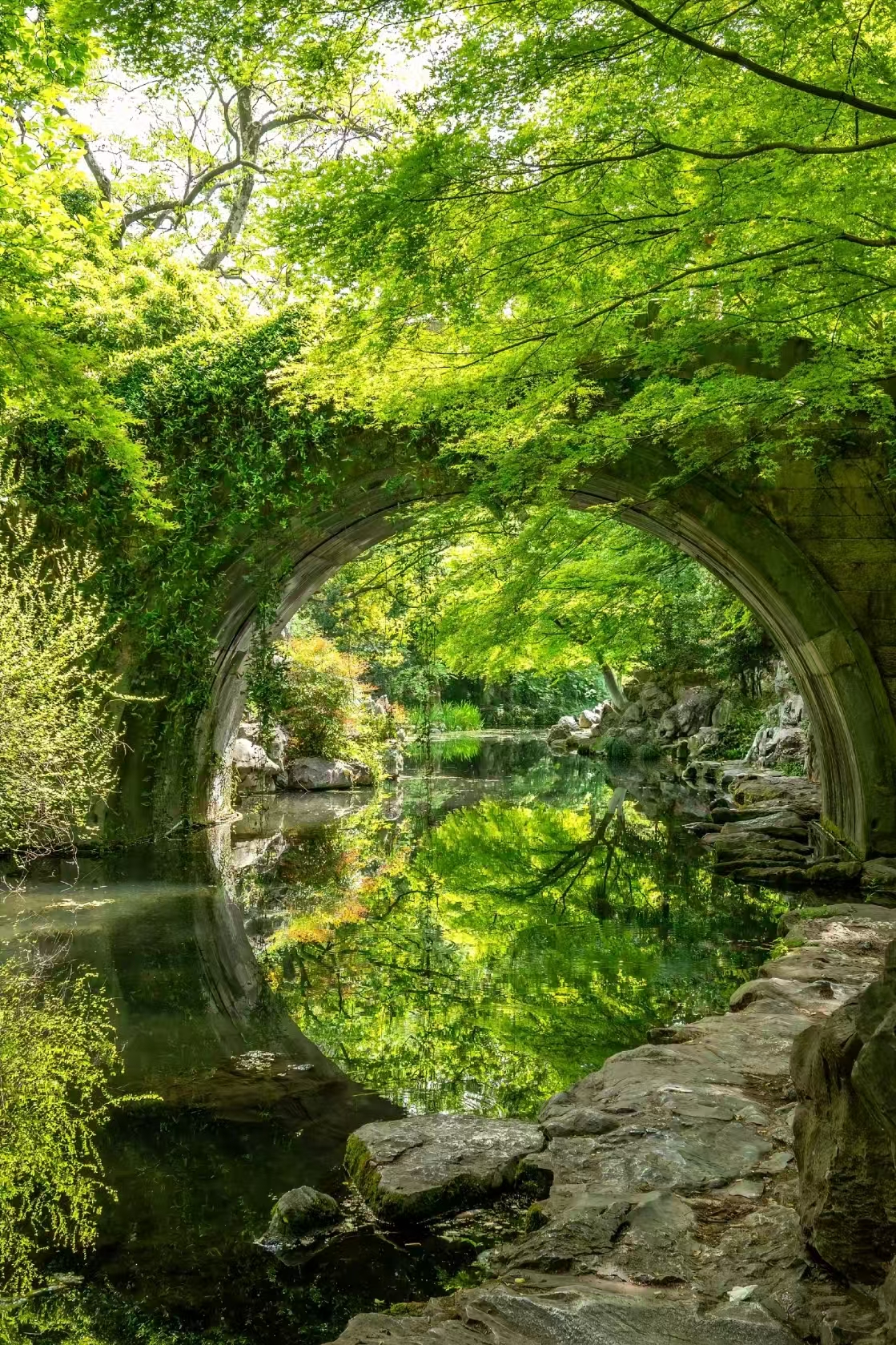 Hangzhou classical garden moon gate arch reflection
